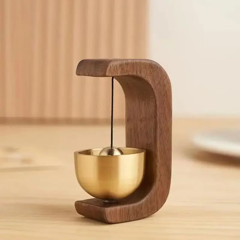 Wireless door chime with brass bell and wood frame