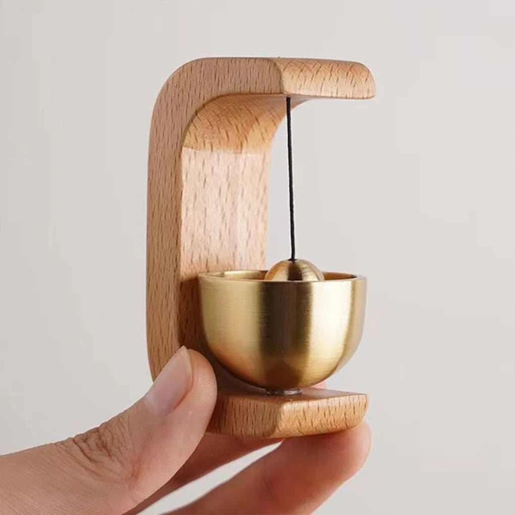 Wireless door chime with brass bell and wood frame