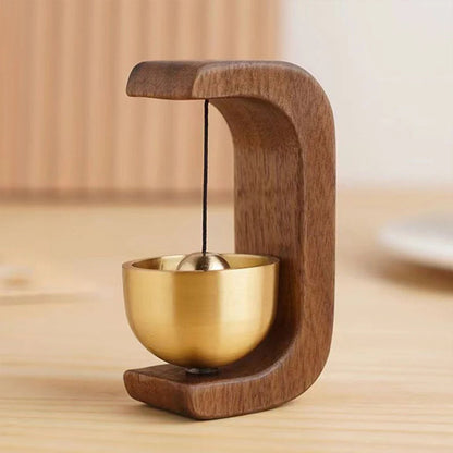 Wireless door chime with brass bell and wood frame