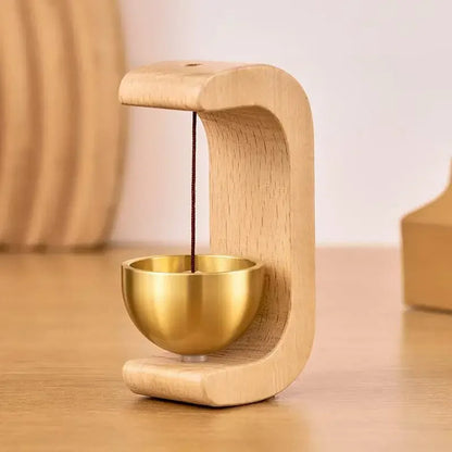 Wireless door chime with brass bell and wood frame