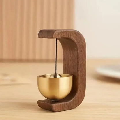 Wireless door chime with brass bell and wood frame